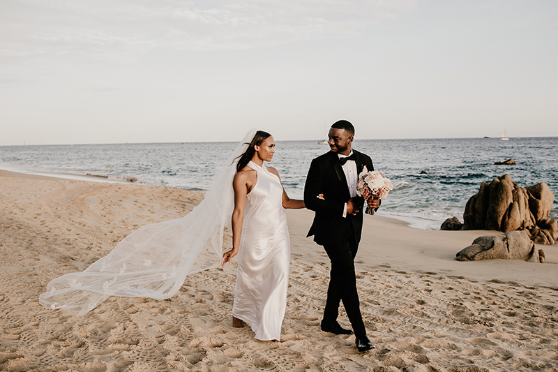 The Newly Weds walking at Pedregal Beach