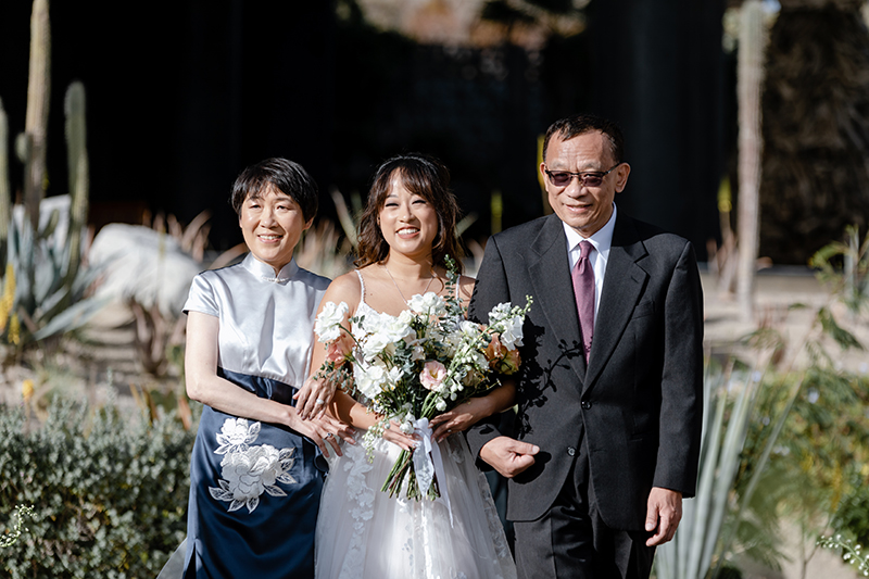Viviana and her Parents Walking to the Wedding Venue