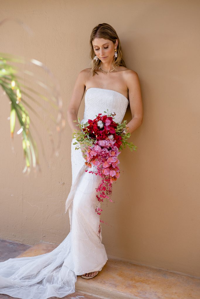 Bride wearing beach wedding dress with light design