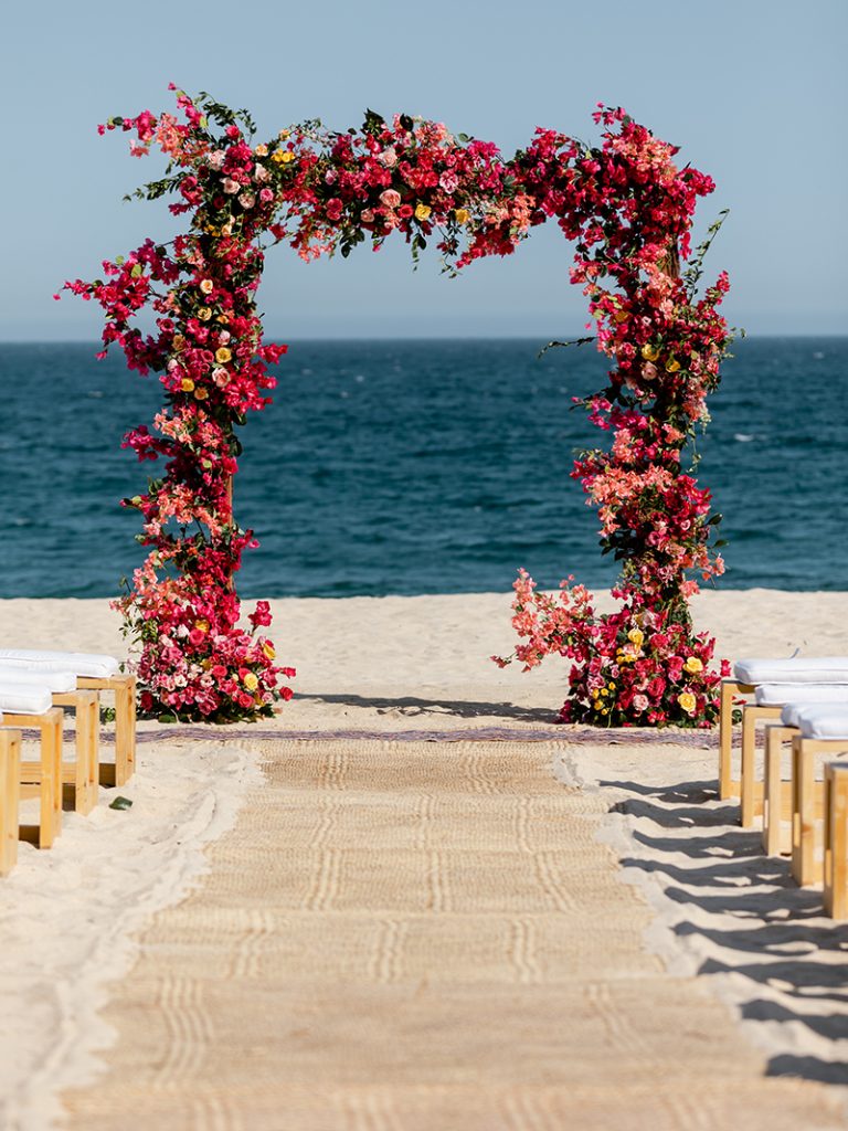 Wedding Arch made of red and pink flowers