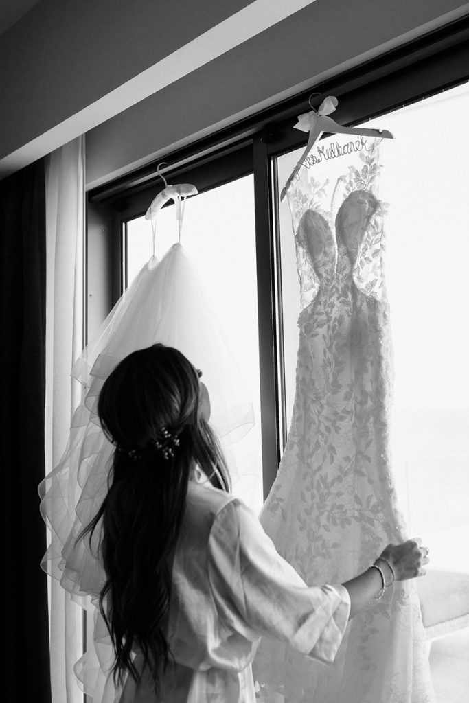 The Bride Staring at her Wedding Dress