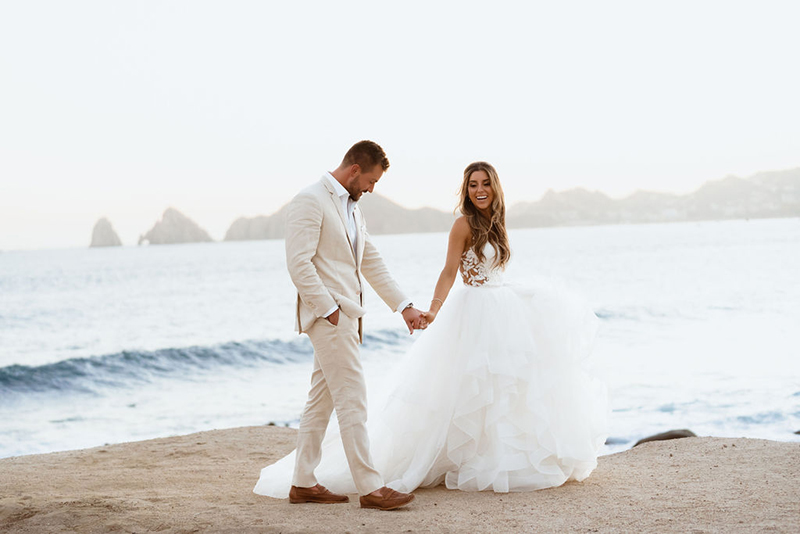 The Newly Weds walking by the Beach in Los Cabos