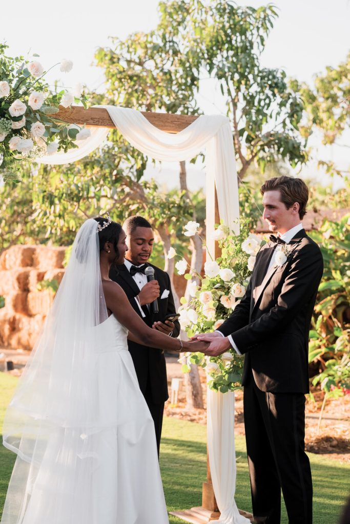 Alex and Ben Holding Hands During Wedding Ceremony