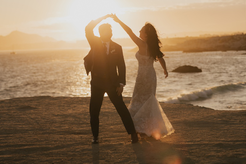 The couple dancing on the beach