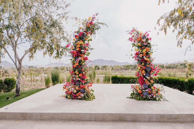 Wedding Arch made of pink, orange and yellow flowers