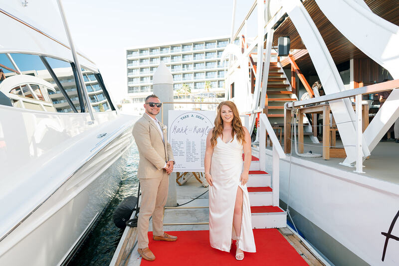 The newly weds welcoming guests aboard "Animalon By the Sea" private yacht