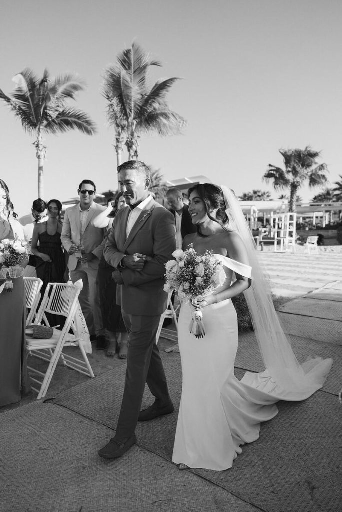 Mackenzie and her father walking down the aisle