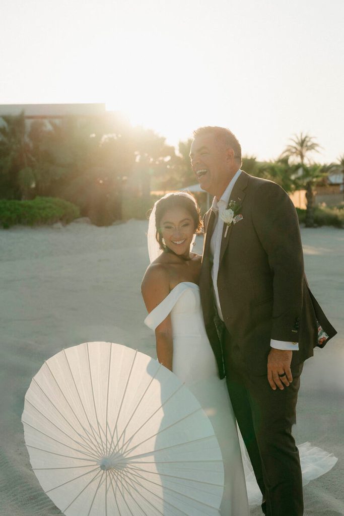 Mackenzie and Scott standing on the beach