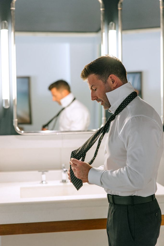 Justin dressing up for the wedding ceremony