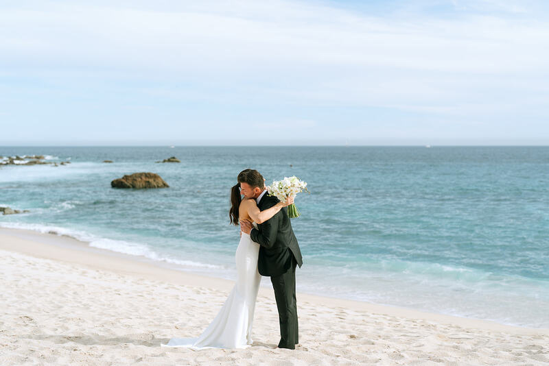 The couple hugging before wedding ceremony