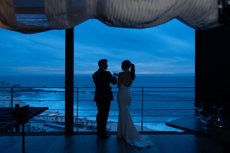 The newly weds starring at the sea