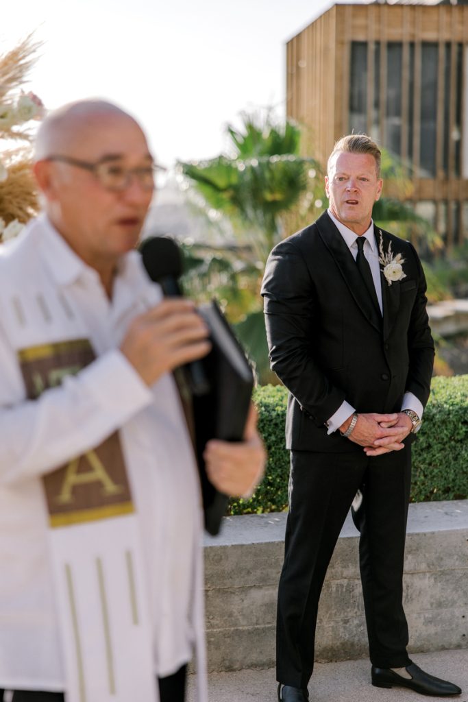 Christian waiting for Showbo at wedding arch
