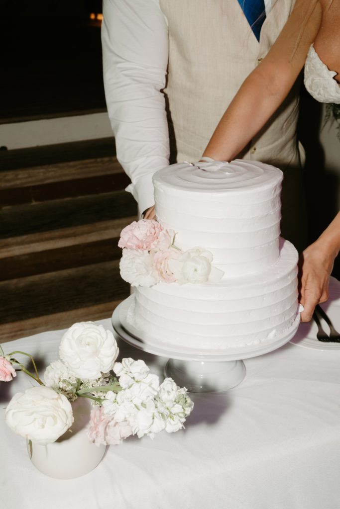 Rachel and Chris Cutting the Wedding Cake