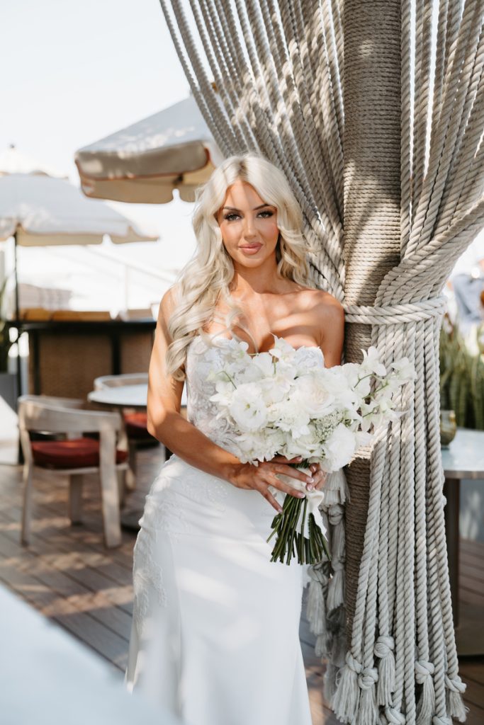 Rachel at Corazon's Roof Top Holding Her Wedding Bouquet