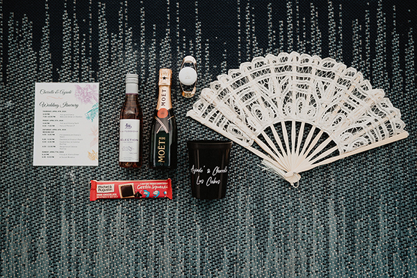 Wedding Welcome Bags example in dark tones featuring a mini Moet bottle