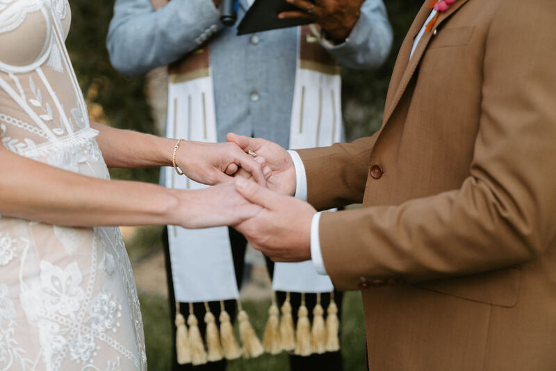 The couple holding hands