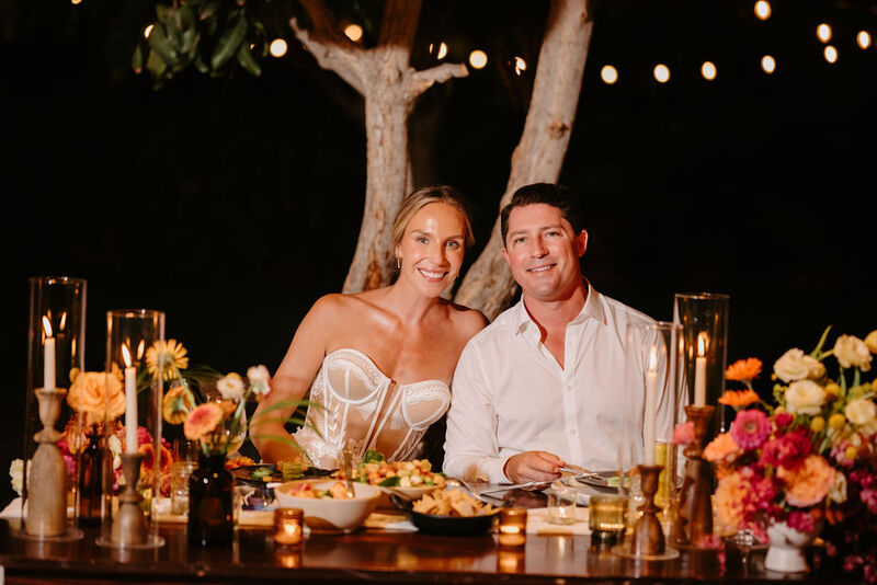 The newly weds having dinner at their sweetheart table