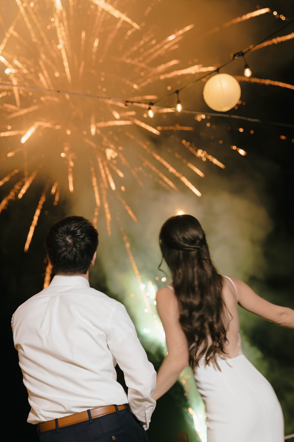 Couple enjoying fireworks at their Destination Wedding in Los Cabos