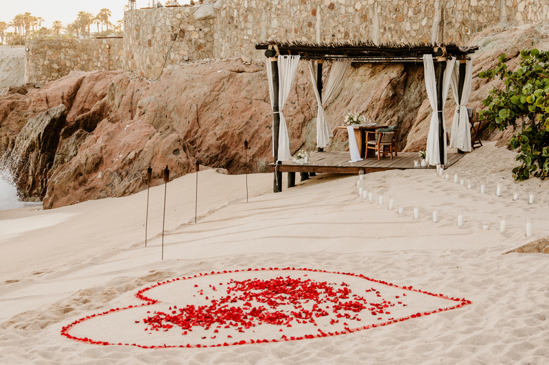 Flower Petals Made Heart over the sand