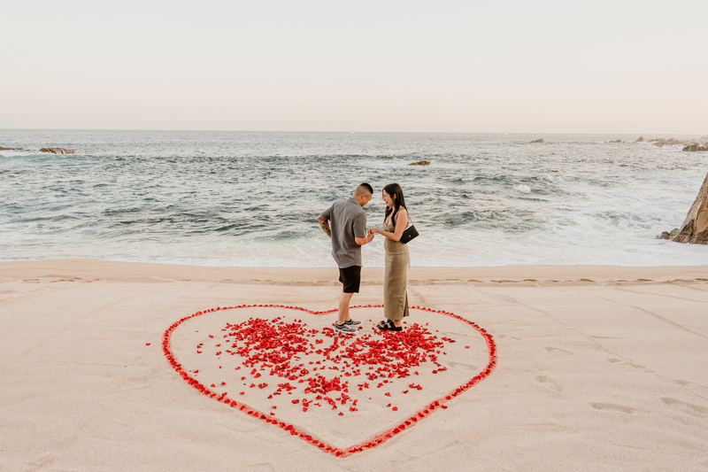 The couple standing inside the flower made heart