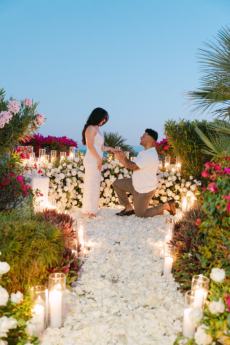 Man on his knee proposing to girlfriend in Los Cabos