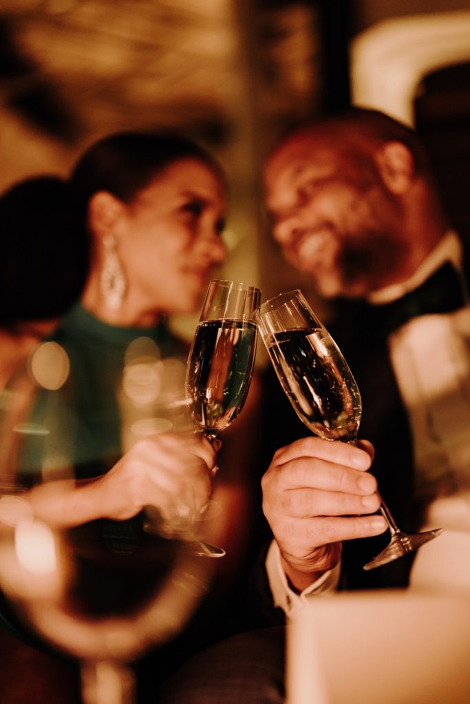 Cherelle and Ayinde making a toast at Chambao