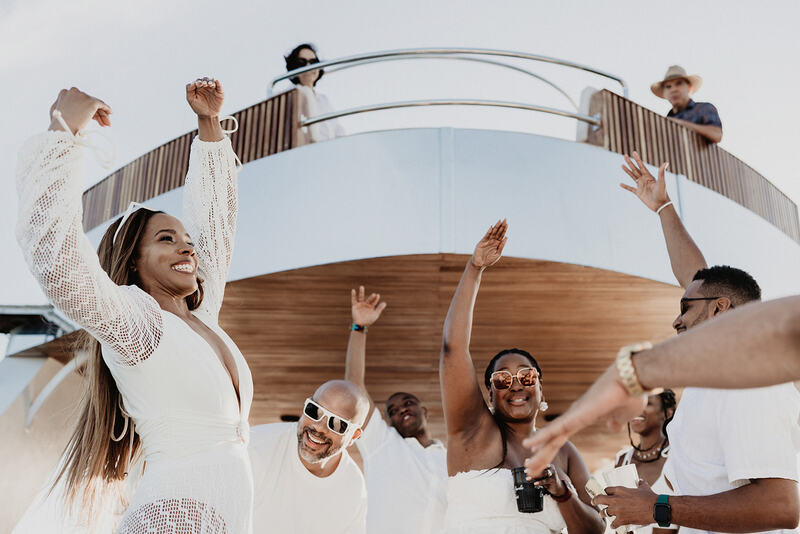 Ayinde and Cherelle enjoying the celebration at Pelican Boat