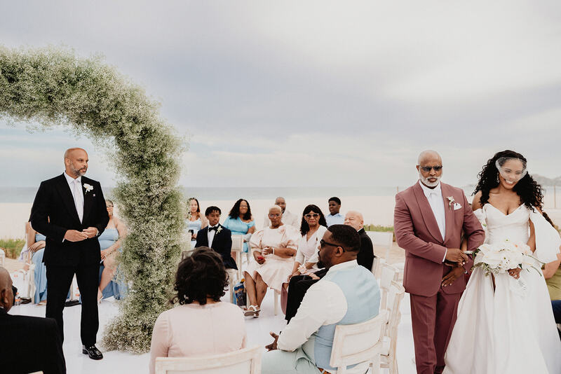 Ayinde waiting for Cherelle by the wedding arch