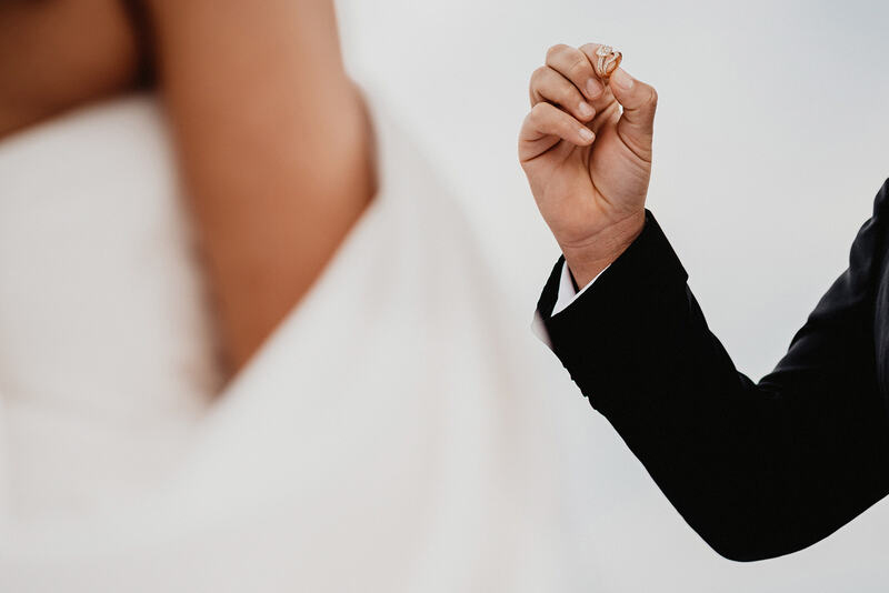 Ayinde holding the wedding band