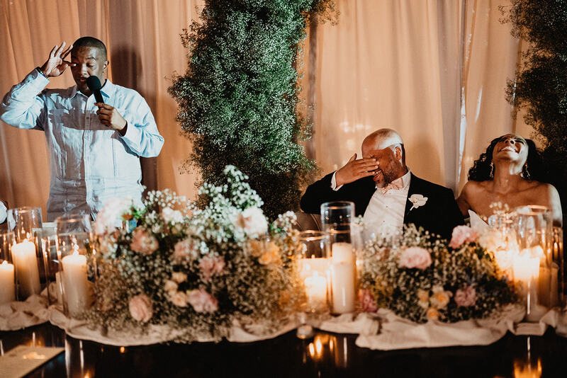 The couple listening to a guest's speech