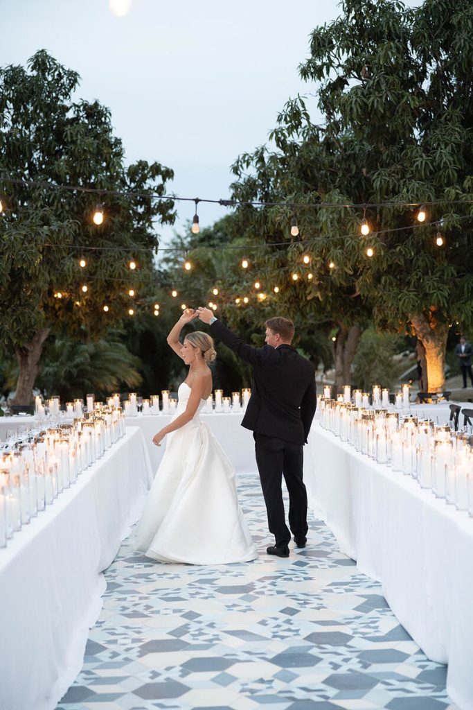 Bella and Mitch Walking through the wedding reception area