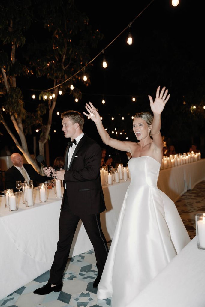 The newly weds making their entrance to their wedding reception party