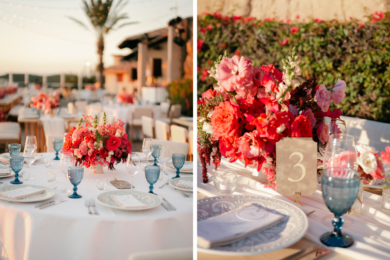 Table centerpieces made with red and pink flowers