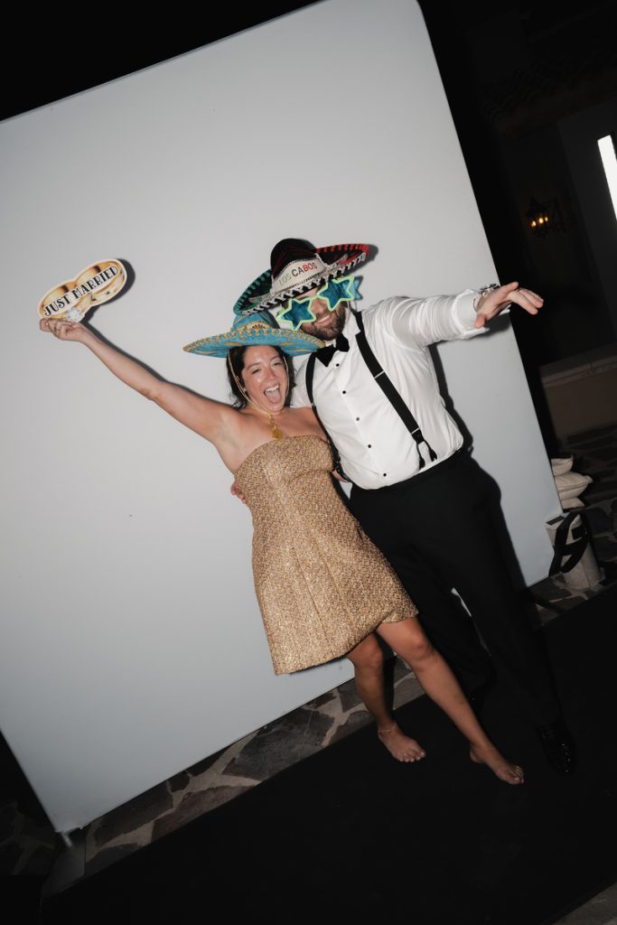 Eric and Courtney wearing funny glasses and hats