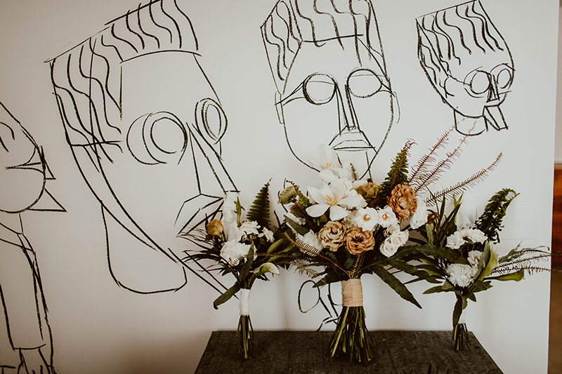 Flower Bouquet over a painted mural at El Ganzo Hotel